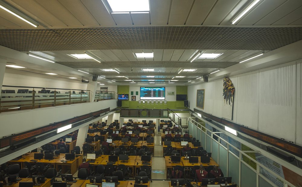 Trading desks and a market display board on the Nigerian Exchange floor